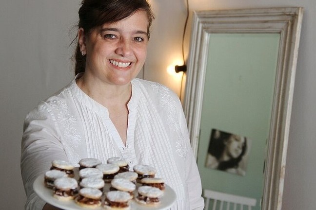 a person holding a birthday cake